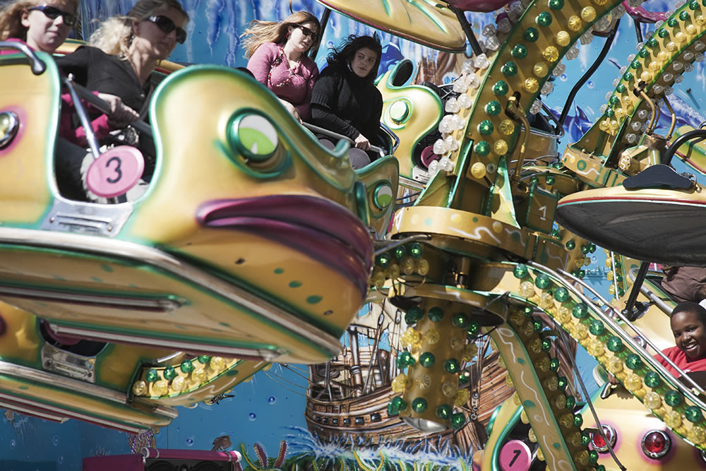 On a mildly-amusing amusement park ride, at a carnival in Sens, France.