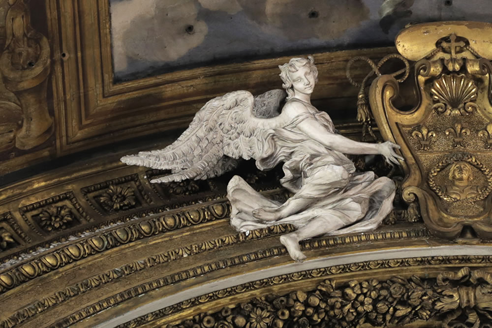 A most marvelous angel I felt observing us, sculpted and flying above an alter in Rome, at the church of Gésu e Maria on Via del Corso, completed in the late 17th century.   