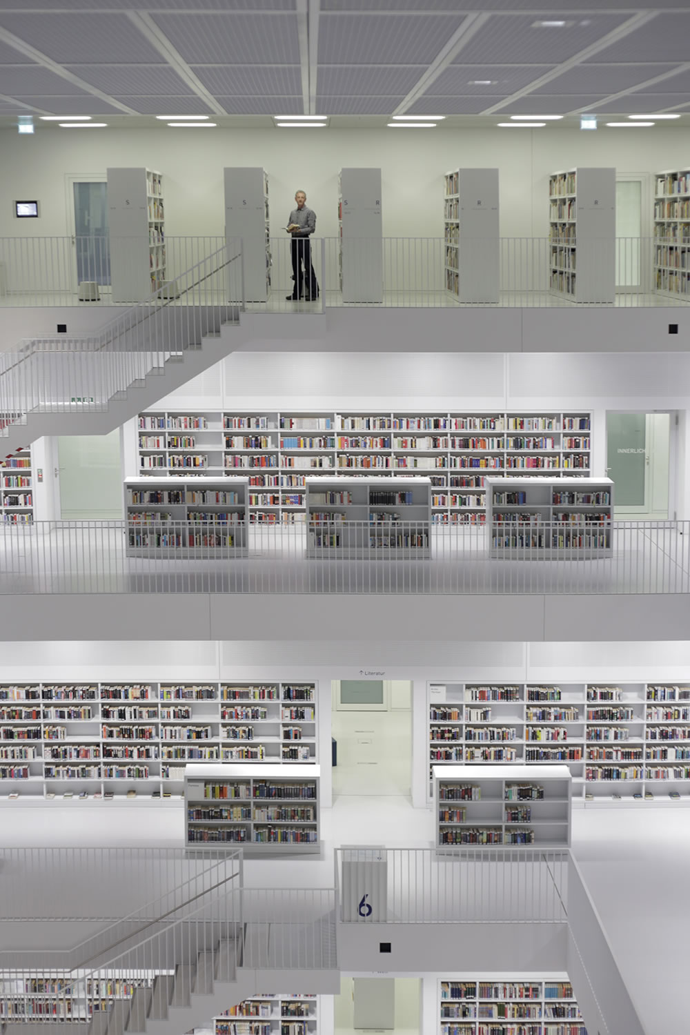 Near closing hour in Stuttgart's Municipal Library, a gorgeously harmonious piece of architecture with a 100cm x 100cm fountain in the center, by Korean architect Eun Young Yi.