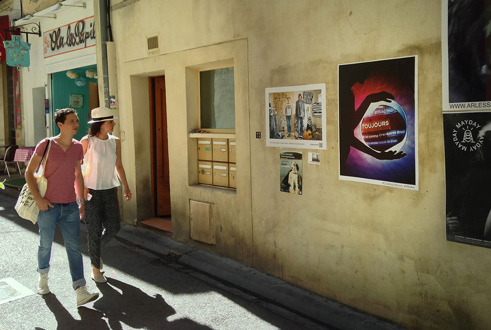 It's currently the opening week of Les Rencontres de la Photographie, the annual photo festival in Arles, France.  My accomplice was sent down, with a broom, a bucket and a map, to paste images from my series Chronic Echo in the sunny streets.