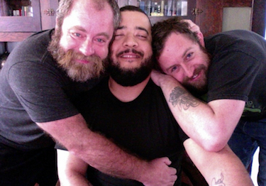 The author, Jeff Leavell, with his husband Alex, and their boyfriend Jon.