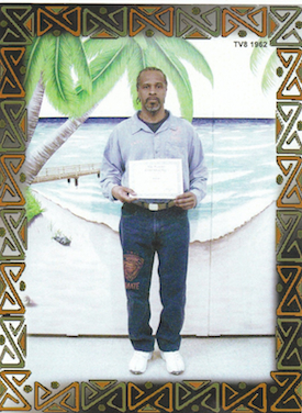 Paul Grice, holding the GED he earned in 2011.