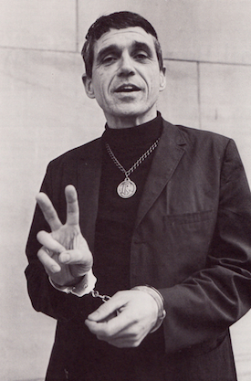 Father Daniel Berrigan handcuffed, circa 1968.