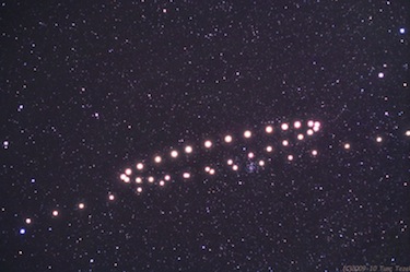 Series of images digitally stacked so that all of the star images  coincide, but you can see the path of Mars during a previous retrograde in 2009. Photo by Tunc Tezel/APOD  . 