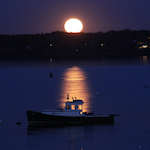 Monday's Taurus Full Moon rising over the islands of Casco Bay, Maine. Photo by Amanda Painter.