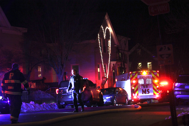 First responders across the street from my house Monday night, Jan. 2. The building on fire was further down the block, on the other side of the street. Photo by Amanda Painter