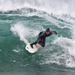 Dexterity.  Surfing at Morro Rock in Big Winter Waves, Morro Bay