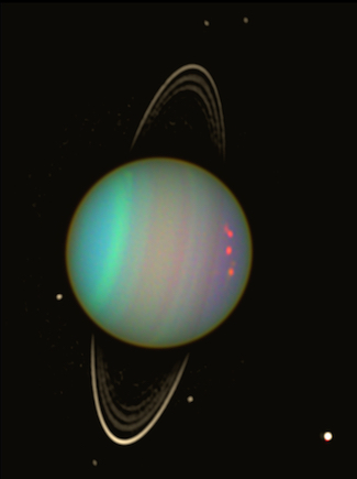 False-color view of Uranus from NASA's Hubble Space Telescope in August 2003. The brightness of the planet's faint rings and dark moons has been enhanced for visibility. Photo by NASA/Erich Karkoschka (Univ. Arizona)
