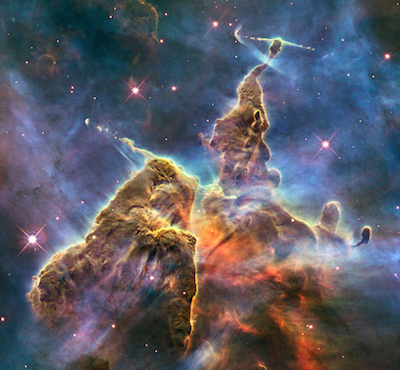 “Mystic Mountain,” a detail from the much more extensive Carina Nebula, which astronomers are studying the complicated physical processes that form new stars. Photo by  NASA, ESA, and M. Livio and the Hubble 20th Anniversary Team (STScI)