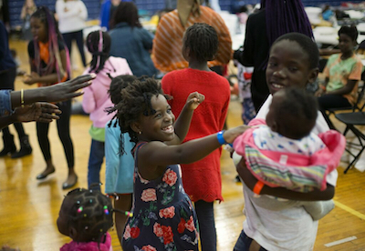 Children dance to music after lunch Wednesday at the Portland (Maine) Expo. Photo by Derek Davis / Portland Press Herald